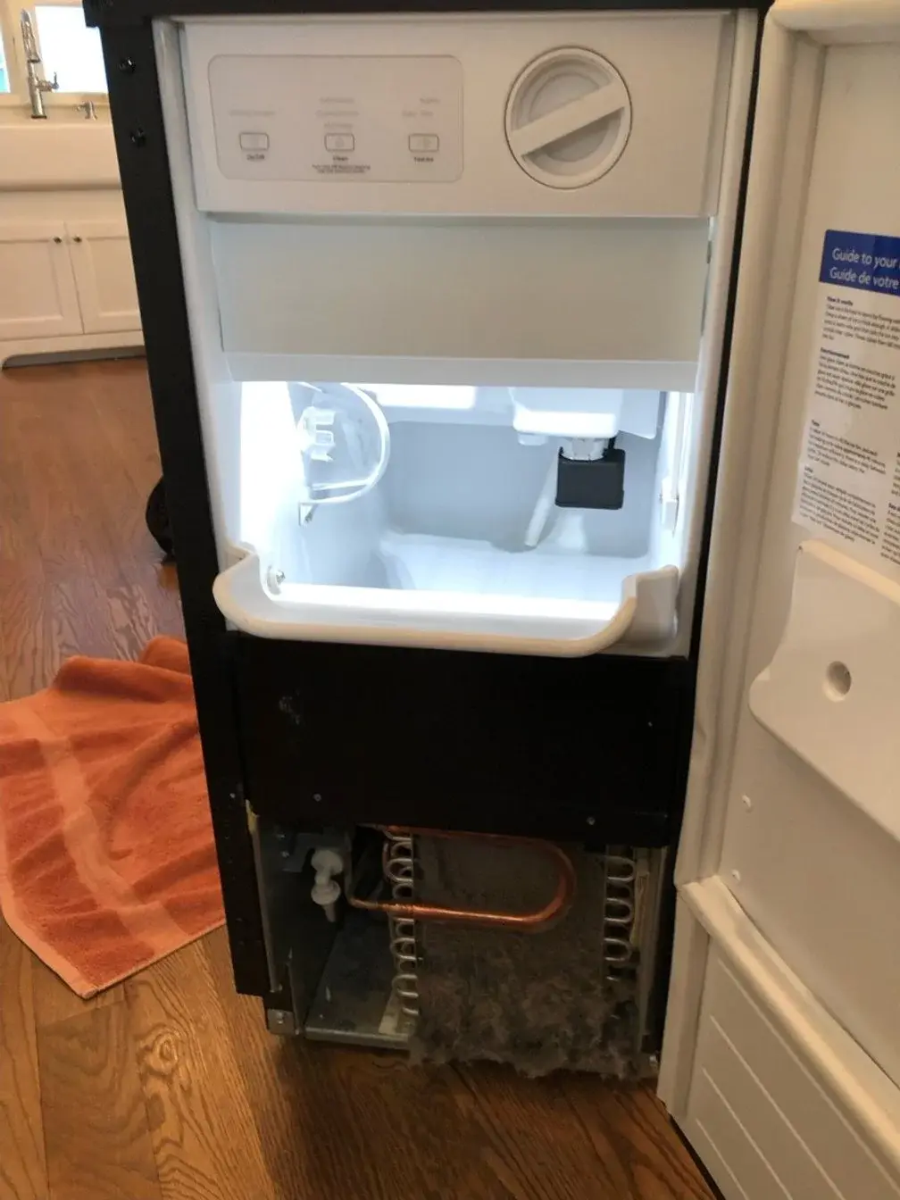 Mr. Fixer technician performing ice maker repair