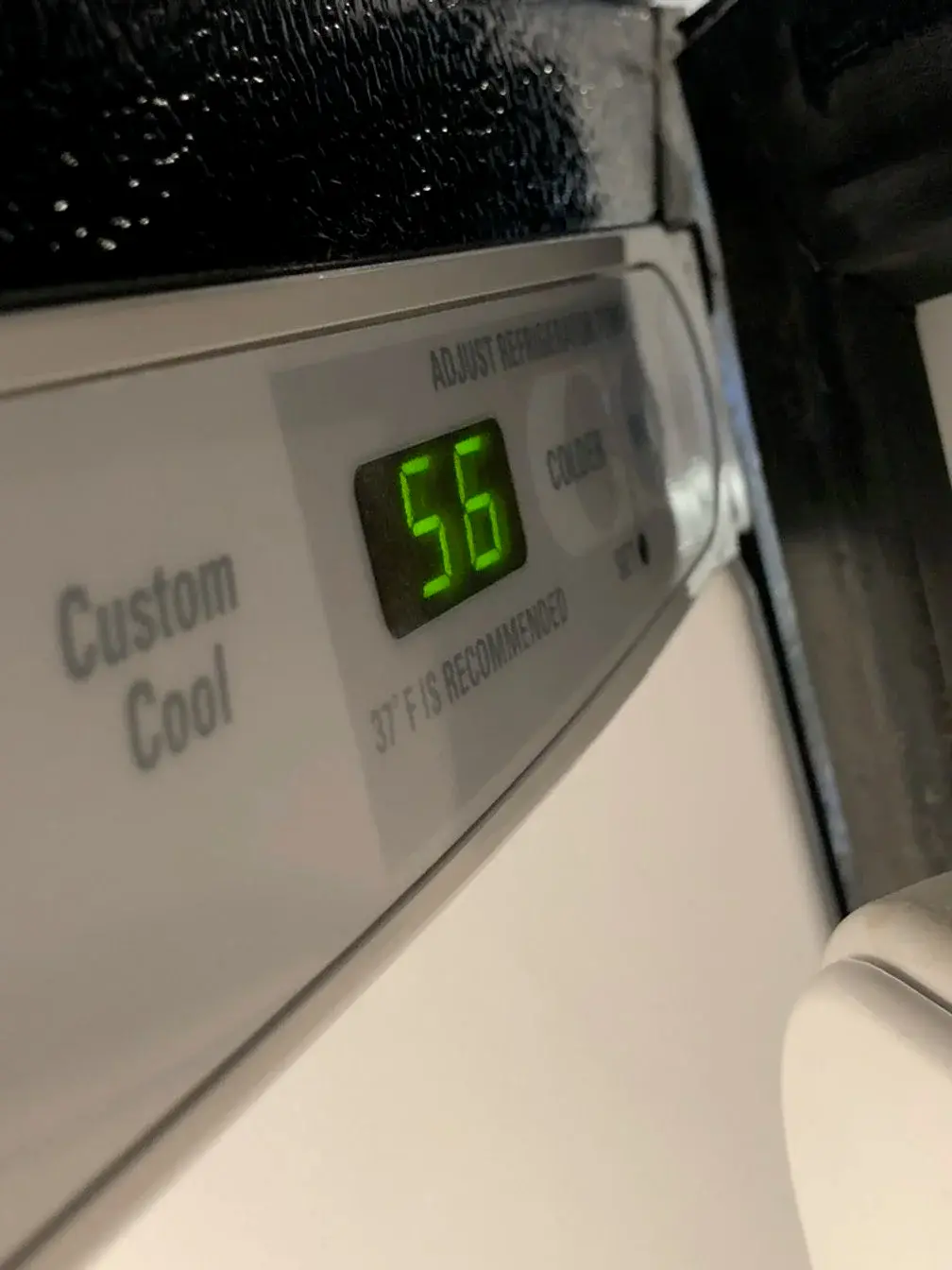 Mr. Fixer technician repairing a Kenmore appliance