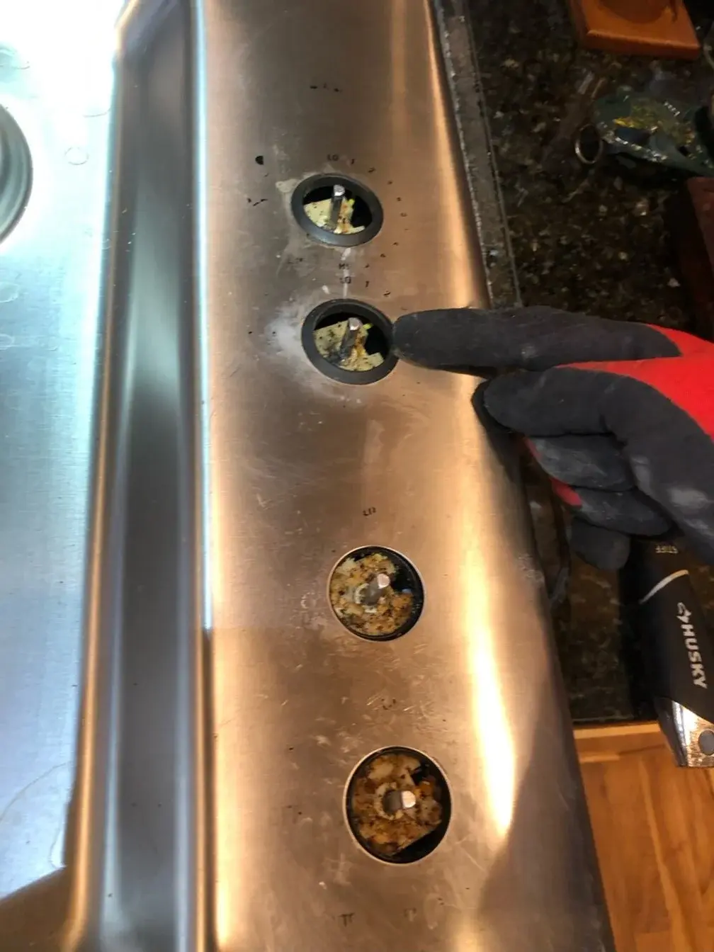 Mr. Fixer technician repairing a Jenn-Air appliance