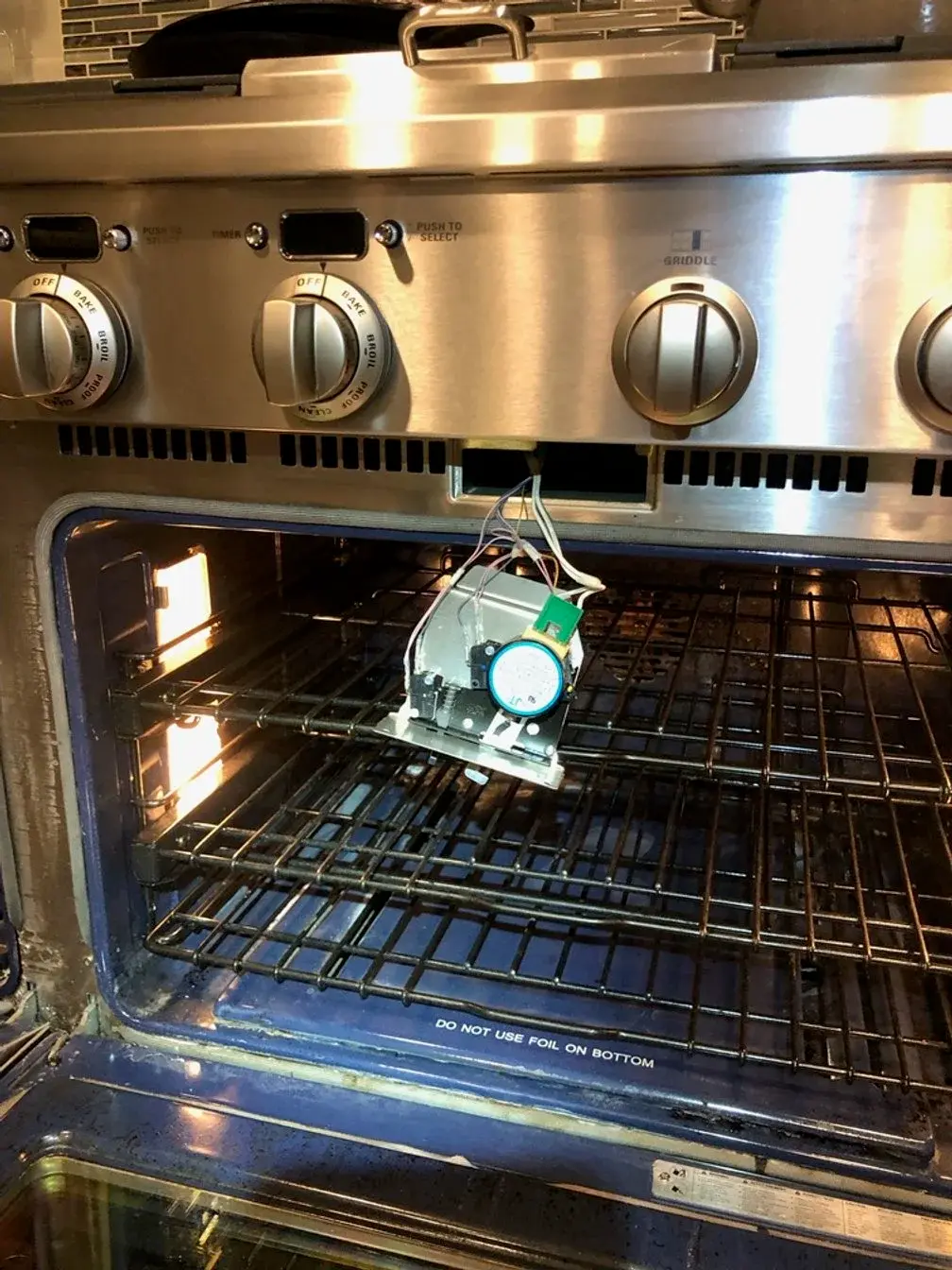 Mr. Fixer technician repairing a Viking appliance